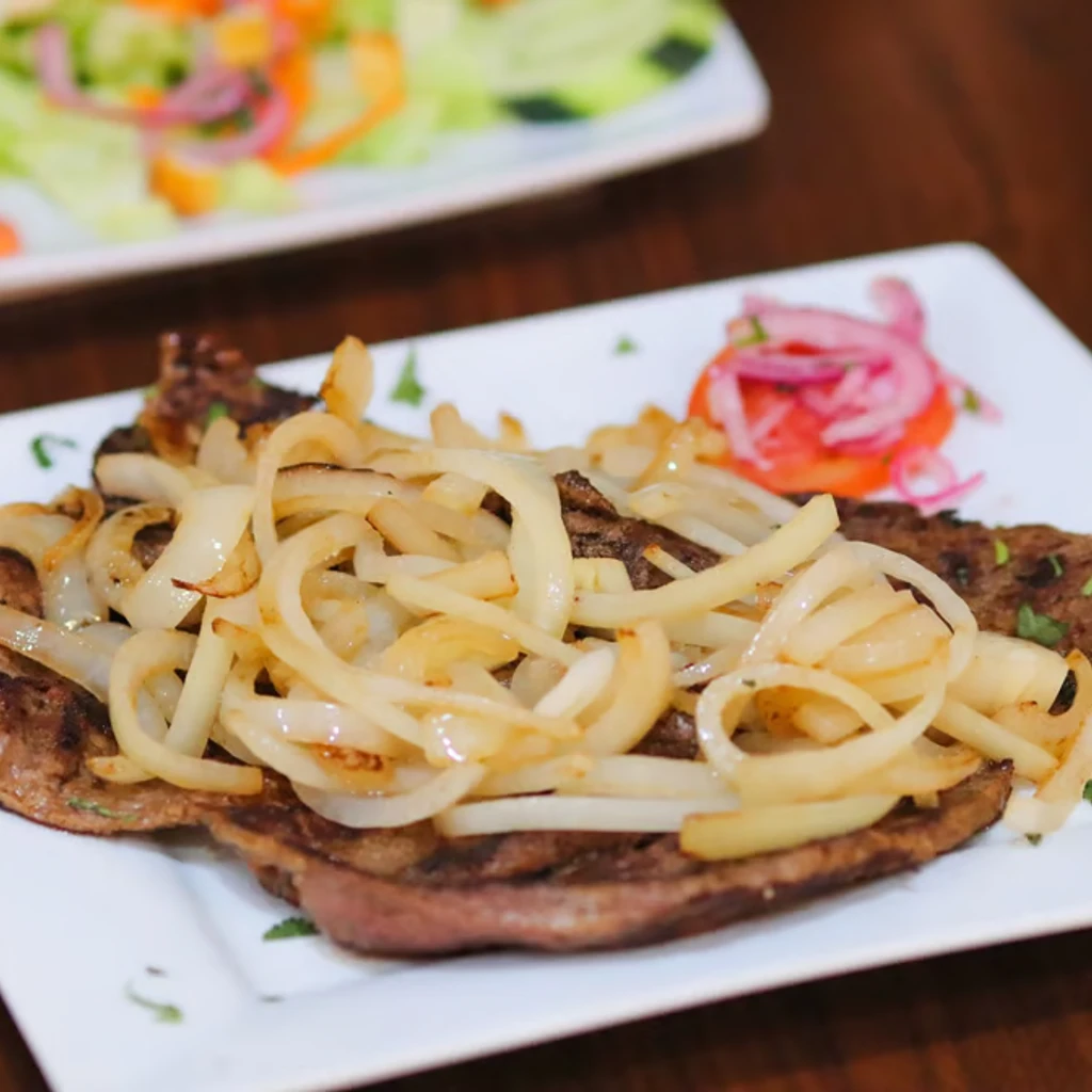 Grilled Steak with Sauté Onions