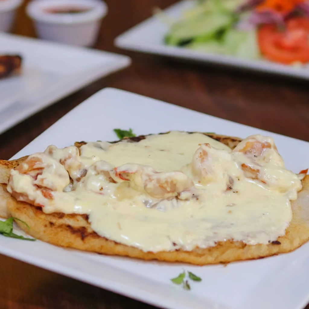 Grilled Chicken with Garlic Shrimp and Bechamel Sauce